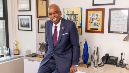 man in a suit posing for a photograph