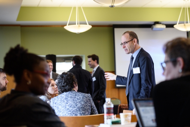 Professor Laby speaking to seated guests